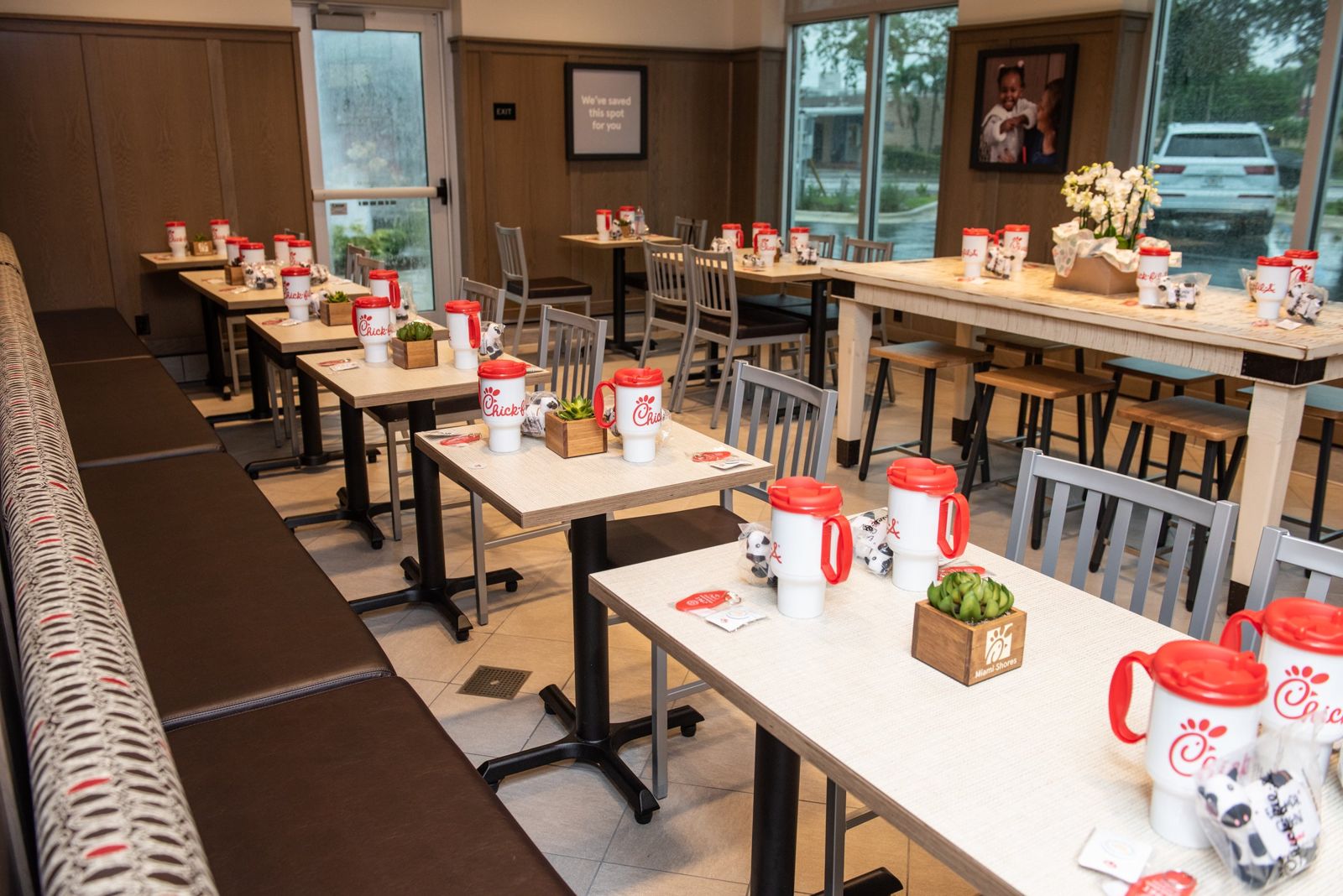 Dining room at Chick-fil-A Miami Shores with tables, booth seating and large windows