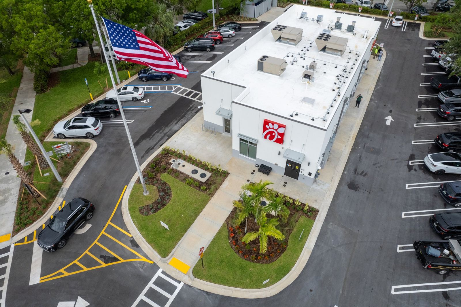 Aerial view of the Chick-fil-A Miami Shores restaurant at 9190 Biscayne Blvd, with its red Chick-fil-A logo, landscaped entrance and American flag
